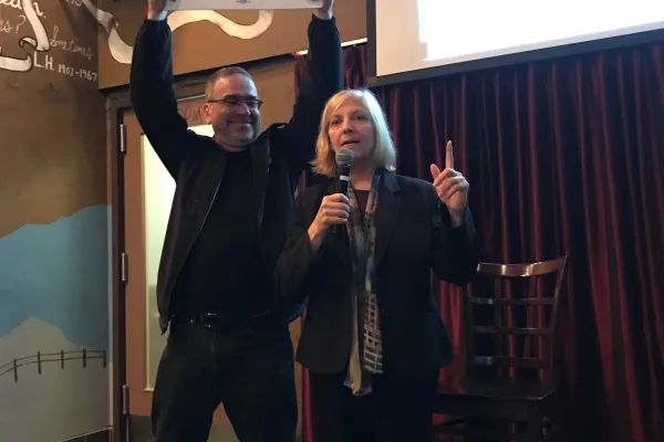 Virginia Diamond speaking into a microphone